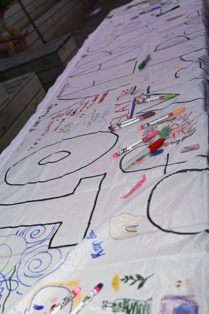 White banner with colored markers