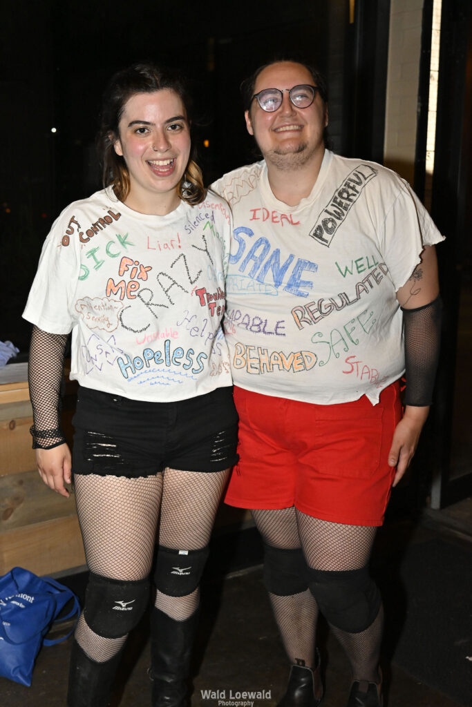 Neilah and friend with matching shirts before performance